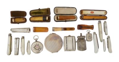 A collection of cheroot holders, silver folding fruit knives and other items