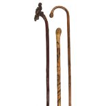 A late 19th century Chinese walking stick and two Japanese walking sticks