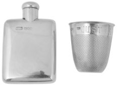 A late Victorian silver novelty thimble tot and a small spirit flask