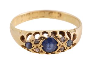 An 18ct gold sapphire and diamond gypsy set ring
