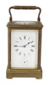 A late 19th century French gilt brass repeating carriage clock with alarm