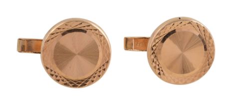 A pair of circular cufflinks