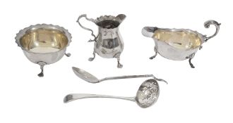 A collection of silver to include sauce boat, cream jug and other items