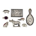 A collection of novelty silver pincushions and other items