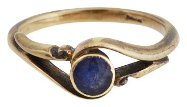 A single stone sapphire cross-over ring