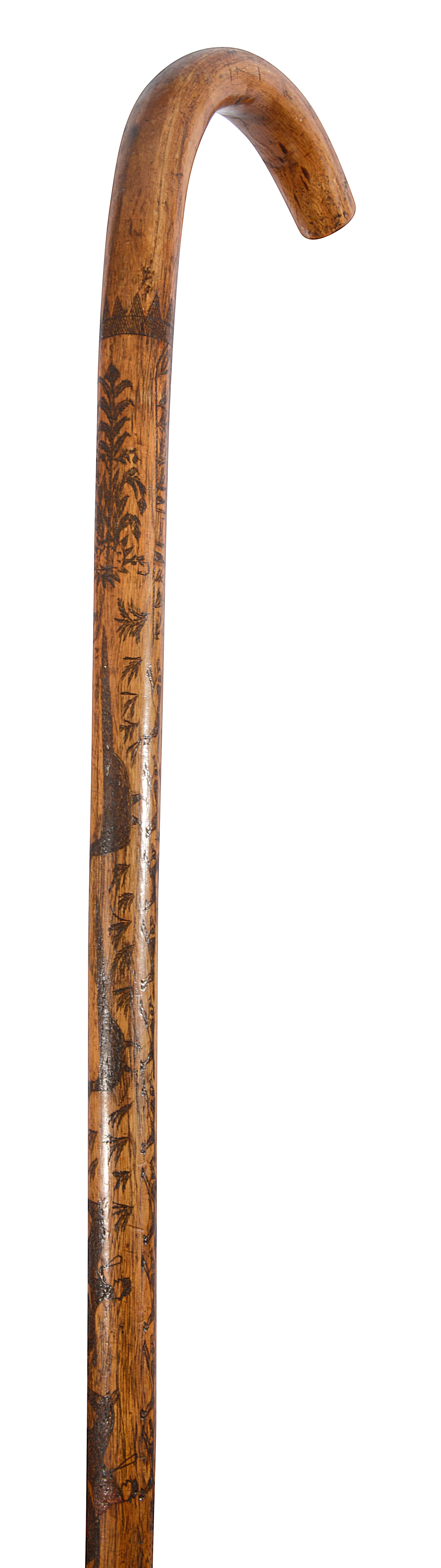 A late 19th century Folk Art scratch carved walking stick