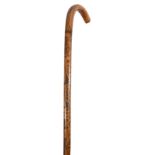 A late 19th century Folk Art scratch carved walking stick