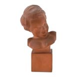 R. Pollin. (French) A terracotta bust of a smiling young boy c.1920