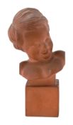R. Pollin. (French) A terracotta bust of a smiling young boy c.1920
