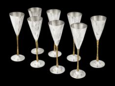 Stuart Devlin. A set of eight silver and parcel gilt champagne flutes