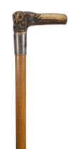 An early 20th century novelty carved antler walking cane