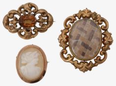 A group of three brooches