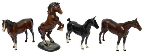 Four Beswick horses