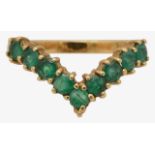 An 18ct gold and emerald wishbone ring