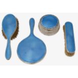 A George VI silver and blue guilloche enamel four piece dressing table set