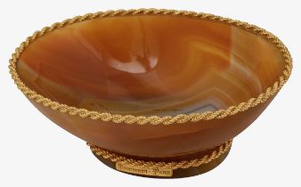 Boucheron. Paris. A small gold mounted banded russet agate dish