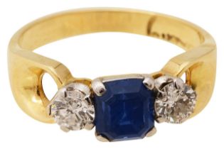 A sapphire and diamond three stone ring