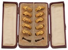 A late Victorian cased jeweller's sample set of 18ct gold plated buckle rings