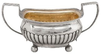 A late George III silver twin handled sugar basin