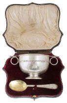 A George V cased silver porringer and spoon