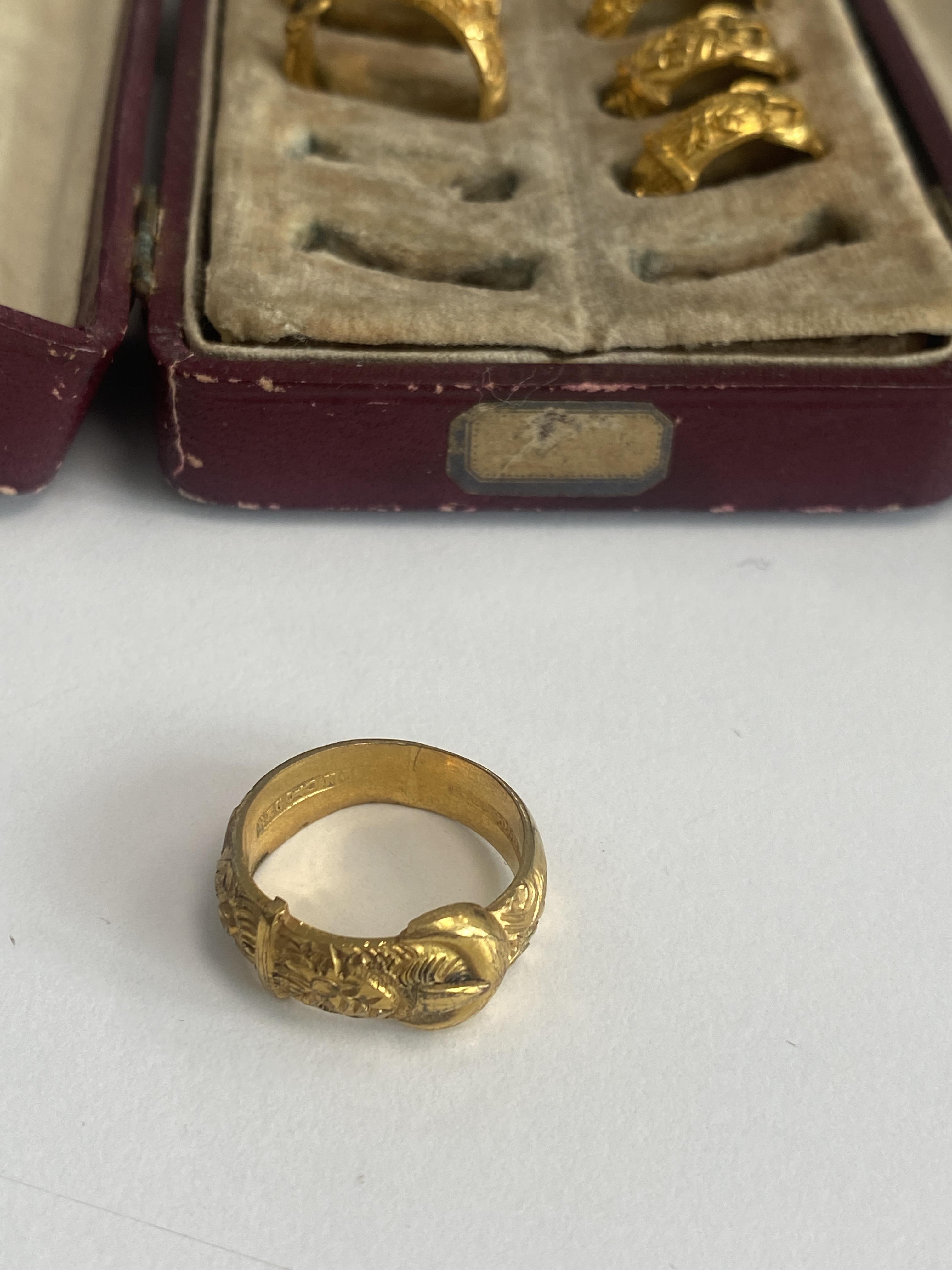 A late Victorian cased jeweller's sample set of 18ct gold plated buckle rings - Image 2 of 4