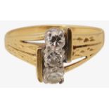 An 18ct gold and diamond three stone ring