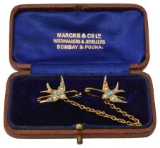 A double swallow brooch