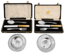 Two Elizabeth II silver prize armada dishes and two cased christening sets