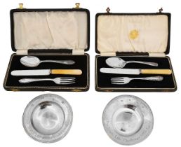 Two Elizabeth II silver prize armada dishes and two cased christening sets