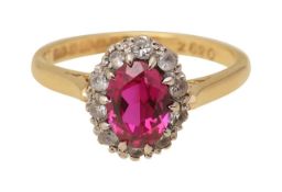 A synthetic ruby and white stone ring