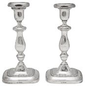 A pair of George V silver candlesticks