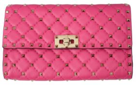 A pink studded shoulder bag by Valentino Garavani