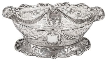 A late Victorian pierced silver footed twin handled basket