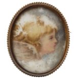 A Victorian painted ceramic and gold mounted brooch