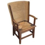 An early 20th century oak framed child's Orkney chair
