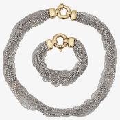 A multi-strand matching necklace and bracelet retailed by Mappin & Webb