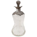 A late Victorian silver mounted glass 'Glug Glug' decanter and stopper