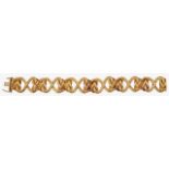 An attractive 18ct gold heart link bracelet by Garrard