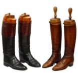 Two pairs of early 20th century leather hunting boots with trees