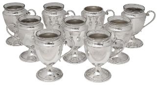 Nine early 20th century Walker and Hall electroplated punch cups