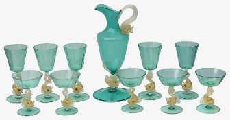 A Venetian Murano suite of of green and aventurine glass dolphin stemware