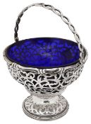 A George V silver swing handled sugar basket