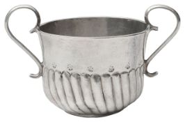 A miniature silver porringer
