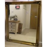 20th century large gilt and bevelled mirror. Approx. 130 x 106cm Reasonable used condition