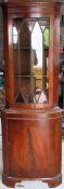 20th century yew wood single door glazed corner display cabinet. Approx. 188 x 65 x 39cms reasonable