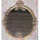 Early 20th century gilt metal framed oval decorative wall mirror. Approx. 49 x 39cms reasonable used