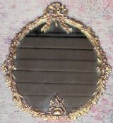 Early 20th century gilt metal framed oval decorative wall mirror. Approx. 49 x 39cms reasonable used