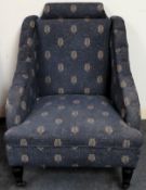 Early 20th century upholstered armchair on ebonised supports. Approx. 92cm H x 73cn W x 78cm D