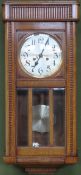 Early 20th century oak cased wall clock with circular silver coloured dial. Approx. 80cms H