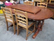 20th century oak extending dining table, with one leaf, also four non matching ladder back chairs